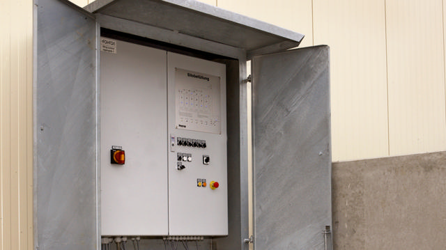 Employee operating the filling control system.